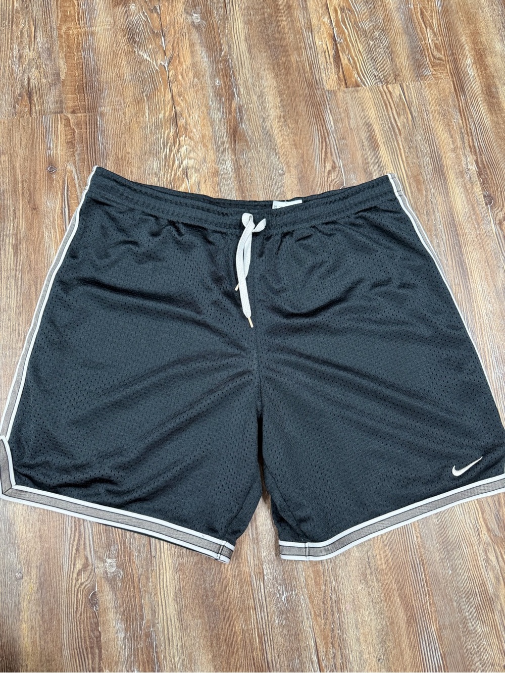 Vintage y2k Nike black shorts with white stripes on sides and hem, size S